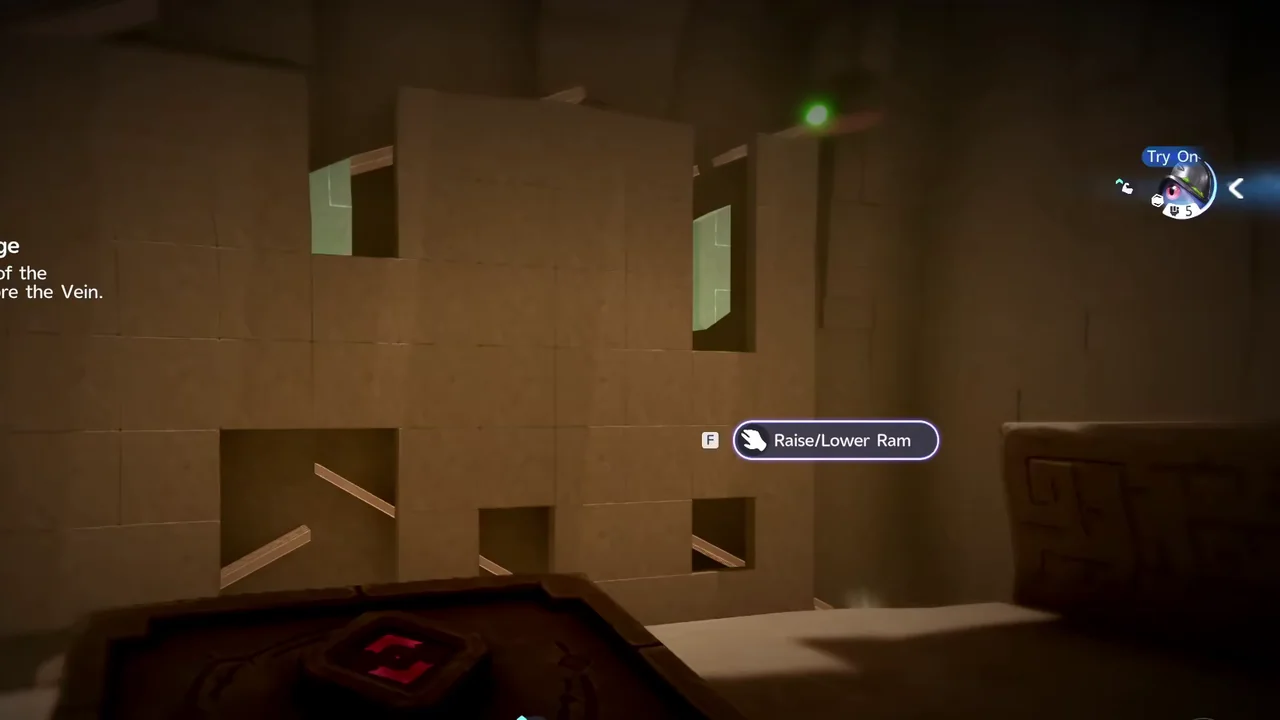 Helmut in front of the puzzle wall, with the Raise/Lower Ram prompt showing