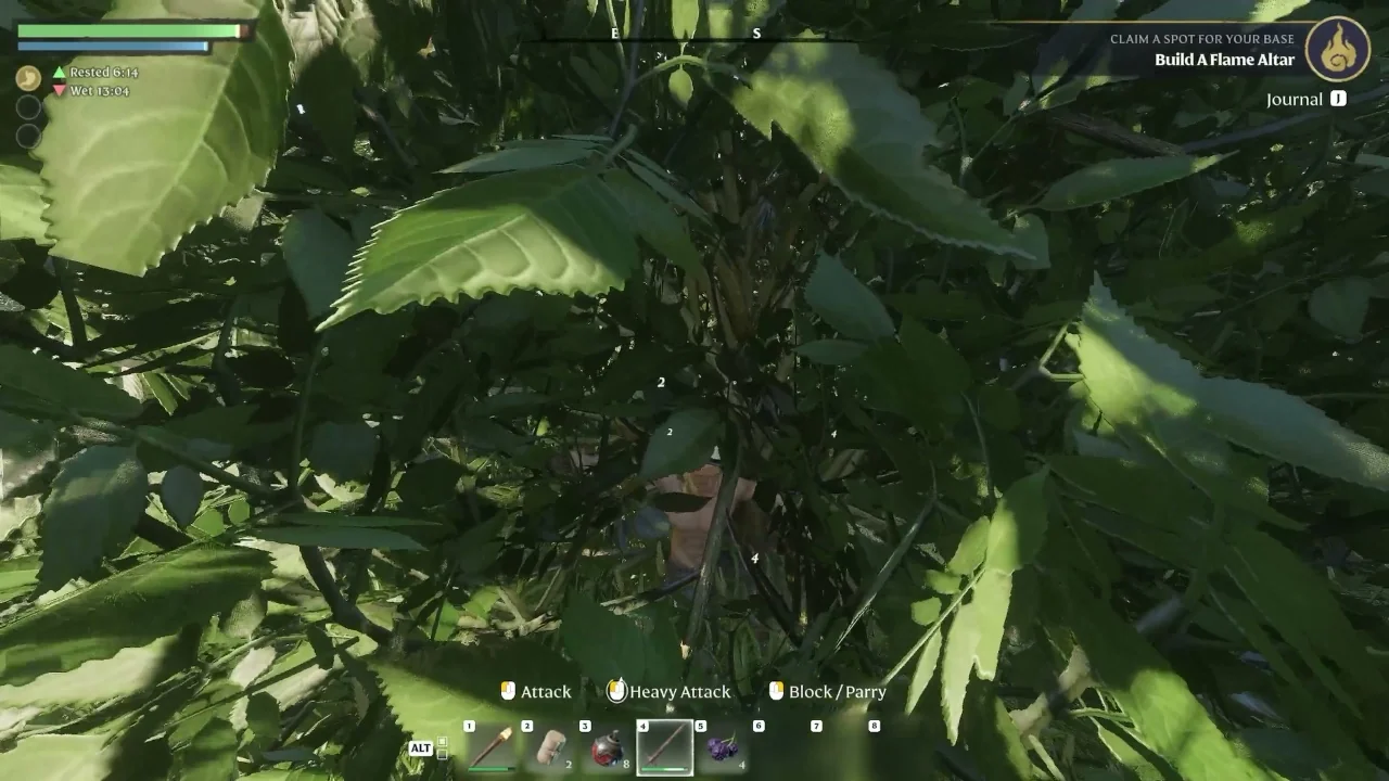 The player swinging a sword into a bush, with damage numbers floating over it