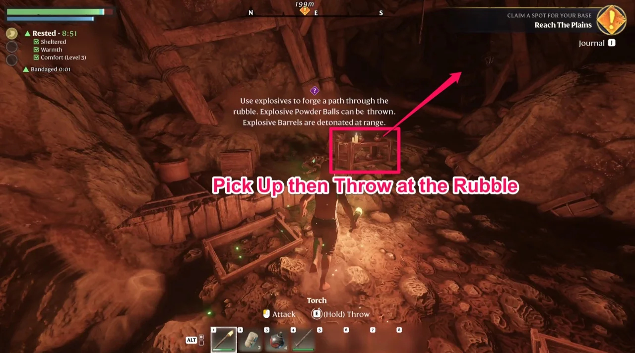 The blocked cave exit with the crates of Explosive Powder Balls marked and the on-screen explanation of the two explosive types