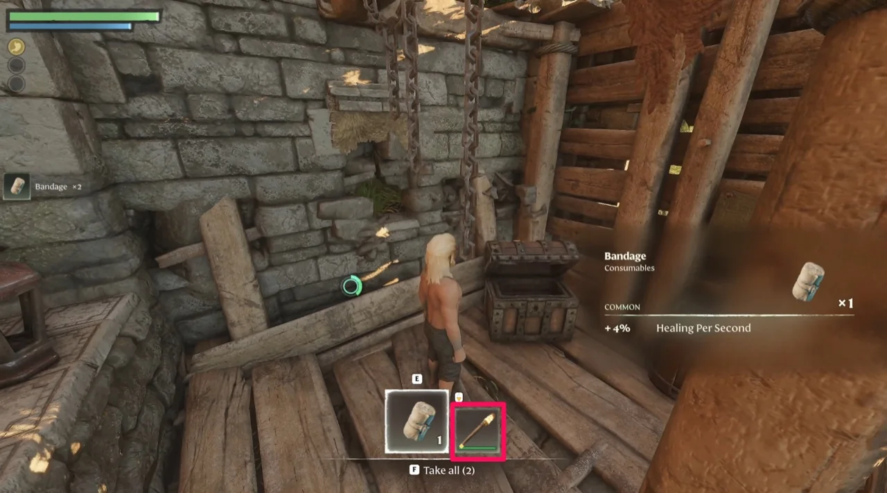 The open chest showing a Bandage and a Torch, with the Take all prompt and the Bandage item description